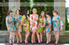 Mismatched Rosy Red Posy Patterned Bridesmaids Robes in Jewel Tones